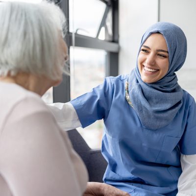 muslim-nurse-talking-to-a-senior-patient.jpg